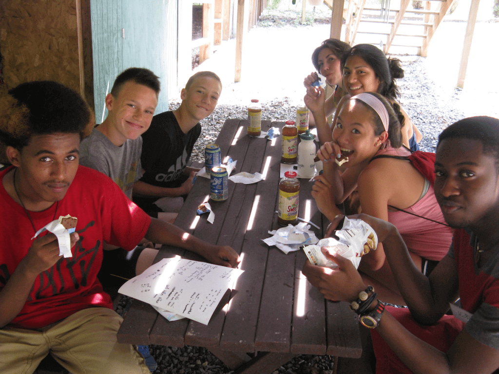 Participants enjoy a relaxing snack at the GYV Cafe! From bottom left - Sirac, from Erritrea and Seattle; Frank, from Poland; Elijah, from Arizona; Nolwenn from France; Ruby, from Massachusetts and Guatemala; Maddy from Virginia; and Kofi, from Ghana