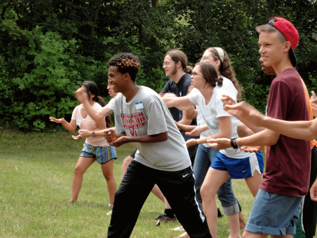 Sirac, from Erritrea, about to throw his teams symbol during "Rock, Paper, Scissor Tag" on GYV's orientation day