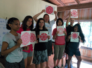 Jada, from North Carolina; Emese, from Hungary; Allyson, from Northern Cheyenne Reservation; Naomi, from Crow Reservation; Haruhi, from Japan, Elijah, from Arizona; and Ruby, from Guatemala share their Chinese Paper Cutting designs at the end of the Chinese Language and Culture elective
